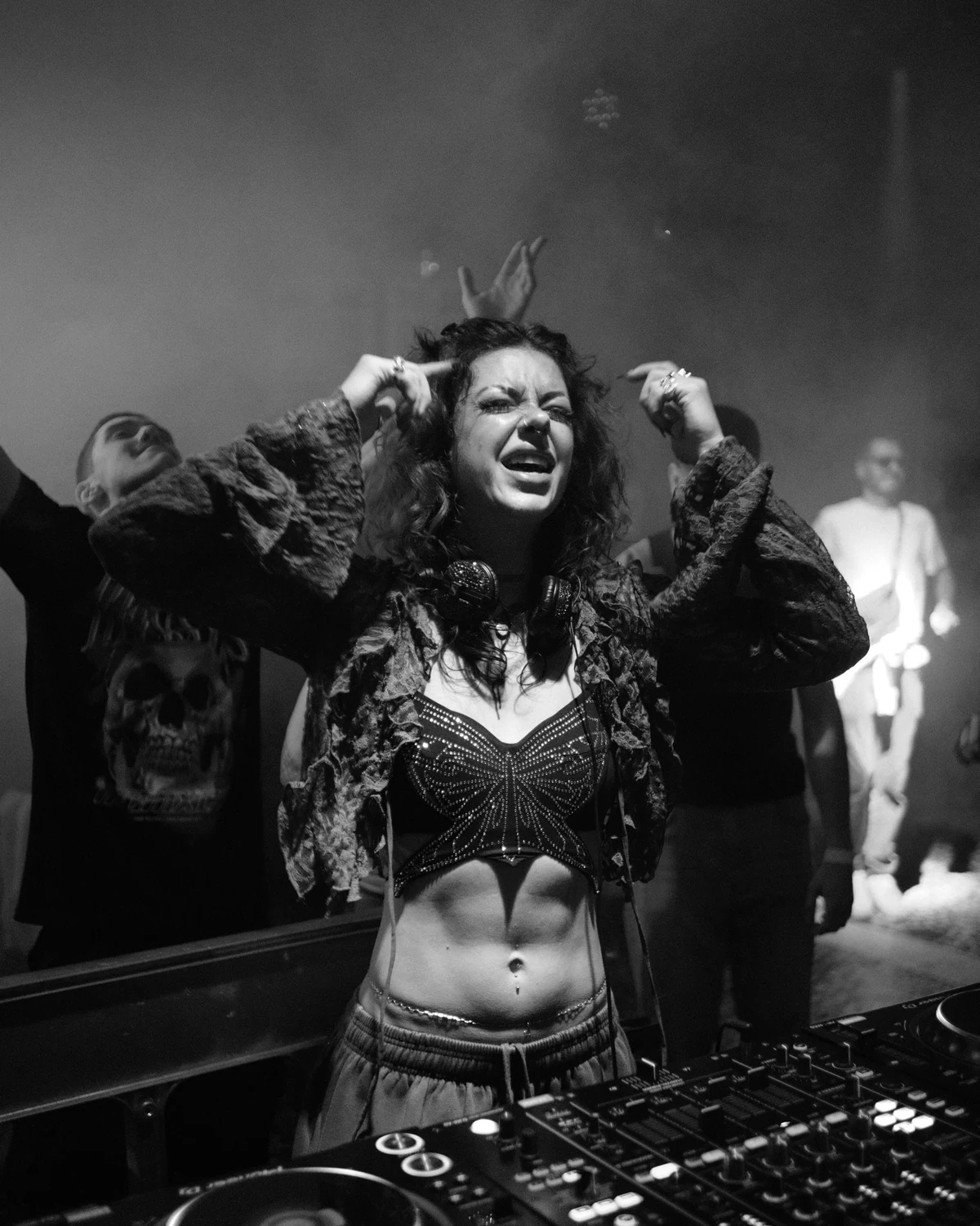 Anastasiya Ty performing behind the decks in black and white